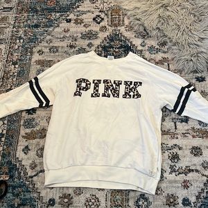 Victoria’s Secret pink crewneck sweatshirt.